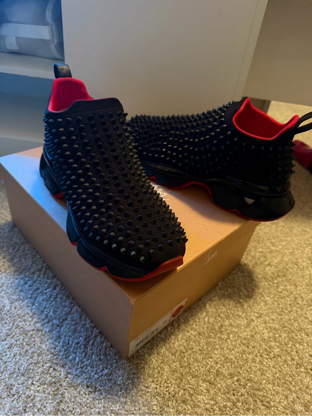 Christian Louboutin Black and Red Spike-Embellished Slip-On Sneakers